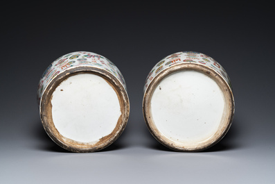 A pair of Chinese famille rose 'antiquities' vases and covers, 19th C.