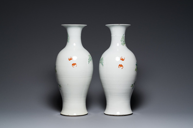 A pair of Chinese famille rose vases with floral design, Qianlong mark, 19/20th C.