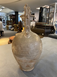 A Chinese straw-glazed stoneware amphora with dragon handles, Tang