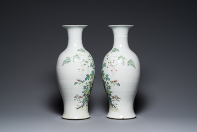 A pair of Chinese famille rose vases with floral design, Qianlong mark, 19/20th C.
