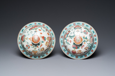 A pair of Chinese famille rose 'antiquities' vases and covers, 19th C.