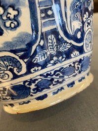 A pair of Dutch Delft blue and white chinoiserie bottle vases, 18th C.