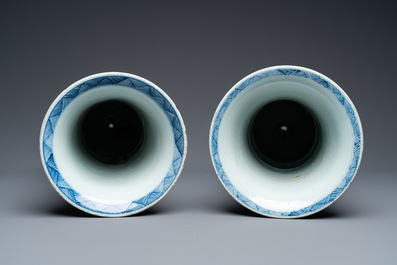 A large Chinese blue and white garniture of three vases, Kangxi