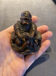 A Chinese bamboo carving of a laughing Luohan, 18th C.