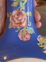 A pair of Chinese blue-ground famille rose vases, He Xuren 何許人 seal mark, 20th C.