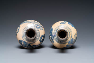 A pair of Vietnamese Bat Trang stoneware bottle vases with clouds, 19th C.