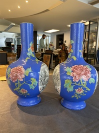 A pair of Chinese blue-ground famille rose vases, He Xuren 何許人 seal mark, 20th C.