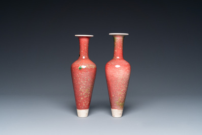 A pair of Chinese peachbloom-glazed vases on wooden stands, Kangxi mark, 19th C.