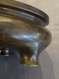 A Chinese bronze tripod censer, Xuande mark, Kangxi/Qianlong