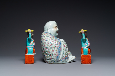 A Chinese famille rose Buddha and a pair of candlesticks, 19/20th C.