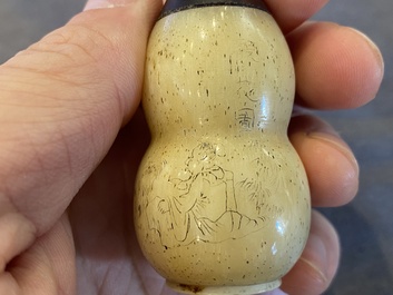 A Chinese Canton enamel snuff bottle and a pair of bone snuff bottles, 19th C.