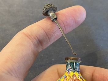 A Chinese Canton enamel snuff bottle and a pair of bone snuff bottles, 19th C.