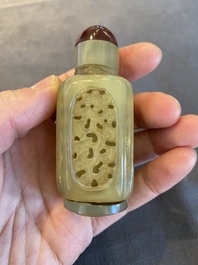 A Chinese reticulated and movable celadon jade snuff bottle, Qing