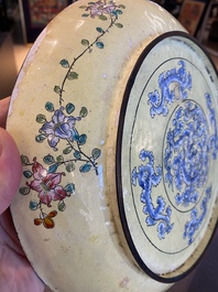 A Chinese Canton enamel dish with a European tea scene and one with ladies and boys, 18/19th C.