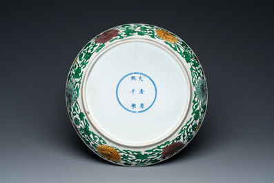 A rare Chinese biscuit-enamelled sancai dish with anhua dragon design, Kangxi mark and of the period