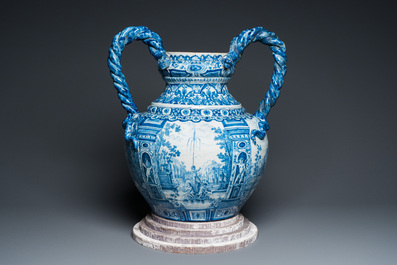 A large Dutch Delft blue and white vase depicting a country house, 1st quarter 18th C.