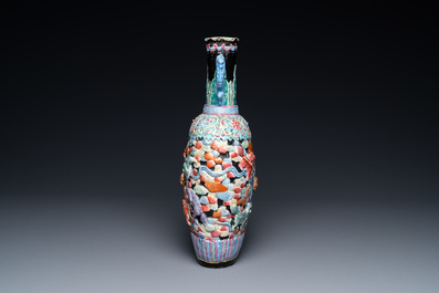 A Chinese famille rose vase with molded design of Buddhist lions, Qianlong mark, 19th C.