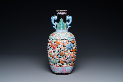 A Chinese famille rose vase with molded design of Buddhist lions, Qianlong mark, 19th C.