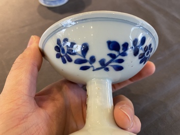 A pair of Chinese blue and white 'lotus scroll' stem cups, Kangxi