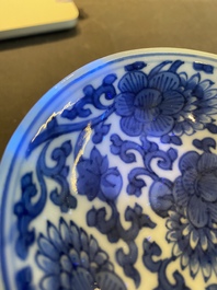 A pair of Chinese blue and white 'lotus scroll' stem cups, Kangxi