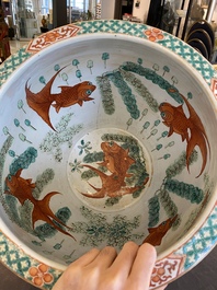 A Chinese famille verte 'silk production' fish bowl, 19th C.