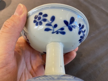 A pair of Chinese blue and white 'lotus scroll' stem cups, Kangxi