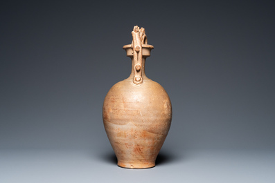 A Chinese straw-glazed stoneware amphora with dragon handles, Tang