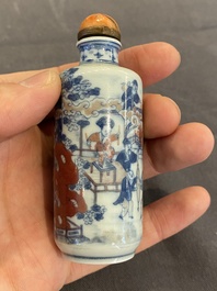 A Chinese blue, white and copper-red snuff bottle, 19th C.