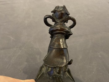 A Chinese bronze waterdropper in the shape of a bixi with rider, Ming
