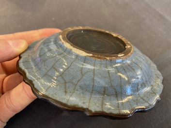 A small Chinese black-glazed double gourd vase and a blue crackle-glazed saucer dish, Qing