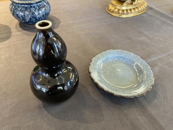 A small Chinese black-glazed double gourd vase and a blue crackle-glazed saucer dish, Qing