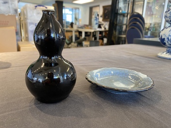 A small Chinese black-glazed double gourd vase and a blue crackle-glazed saucer dish, Qing