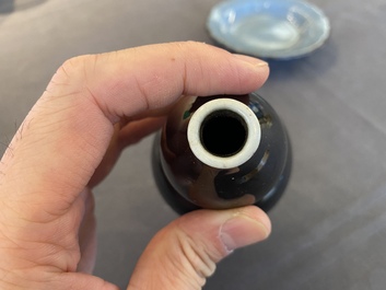 A small Chinese black-glazed double gourd vase and a blue crackle-glazed saucer dish, Qing