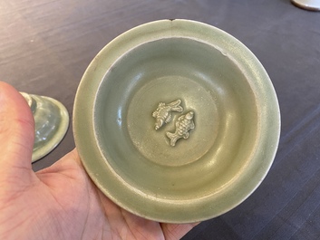 Two Chinese celadon-glazed bowls, one with twin fish, Ming