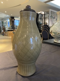 A Chinese Longquan celadon vase with underglaze design, Yuan or later