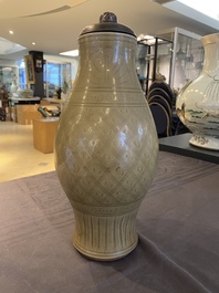 A Chinese Longquan celadon vase with underglaze design, Yuan or later