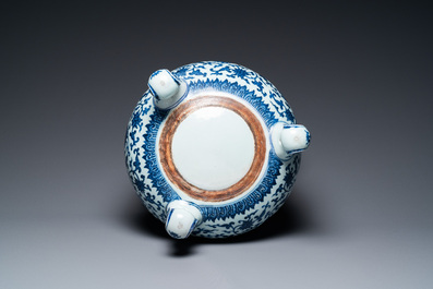A large Chinese blue and white 'bajixiang' tripod censer with lotus scrolls, Qianlong