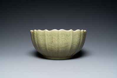 A large Chinese Longquan celadon bowl with underglaze lotus design, Ming