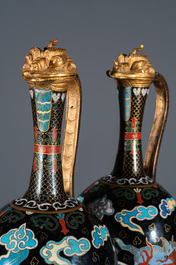 A pair of Chinese cloisonn&eacute; 'mythical beasts' ewers with zoomorph gilt covers, Qing