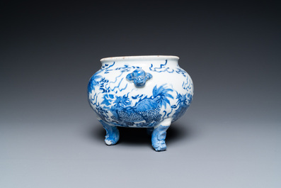 A Chinese blue and white 'mythical beasts' tripod censer, 19th C.