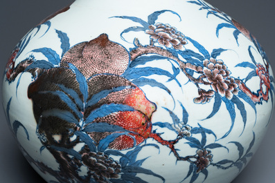 A Chinese blue, white and copper-red 'nine peaches' bottle vase, Guangxu mark and of the period