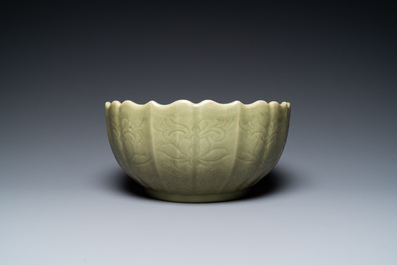 A large Chinese Longquan celadon bowl with underglaze lotus design, Ming