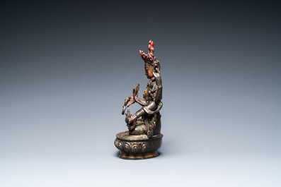 A Sino-Tibetan gilt-lacquered bronze Vasudhara, 17th C.