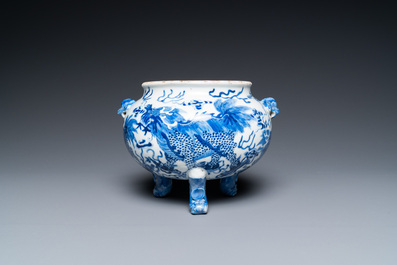 A Chinese blue and white 'mythical beasts' tripod censer, 19th C.