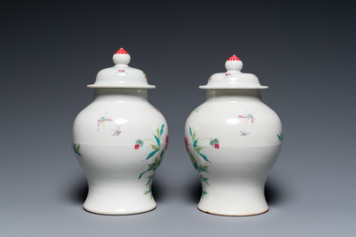A pair of fine Chinese famille rose vases and covers, 19th C.