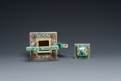 A square Chinese turquoise-ground verte biscuit teapot and cover, Kangxi