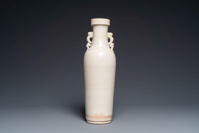 A Chinese monochrome Swatow vase with dragon handles, Transitional period