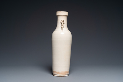 A Chinese monochrome Swatow vase with dragon handles, Transitional period