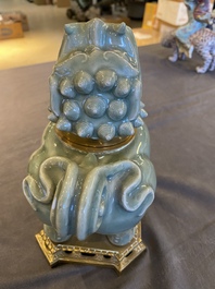 Een Chinese Longquan celadon wierookbrander in de vorm van een luduan met vergulde bronzen montuur, Ming