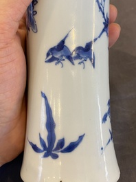 A Chinese blue and white vase with birds in a blossoming setting, Transitional period